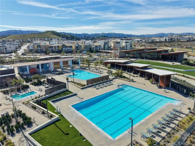 an aerial view of residential houses and outdoor space