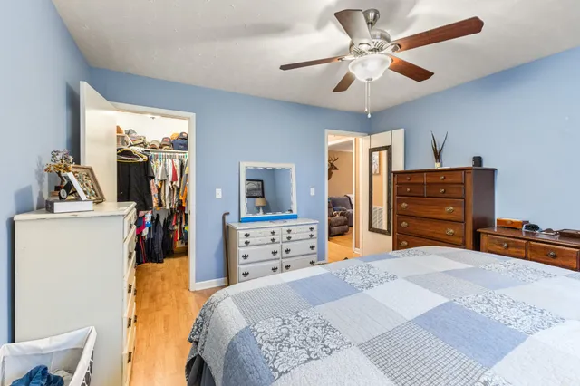 a bedroom with a bed and a dresser