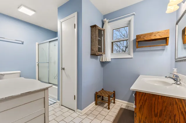 a front view of a house with parking lot