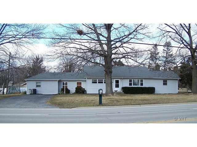 2547 Caton Farm Road Joliet, IL 60435 - Photo 2 of 17 a view of a yard in front of a house