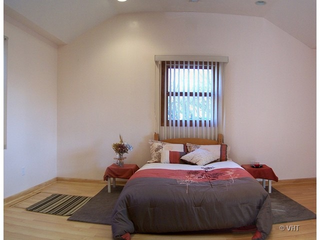 2547 Caton Farm Road Joliet, IL 60435 - Photo 6 of 17 a bedroom with a bed and window