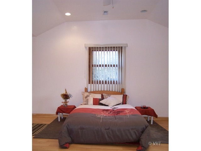 2547 Caton Farm Road Joliet, IL 60435 - Photo 7 of 17 a bedroom with a bed and a window