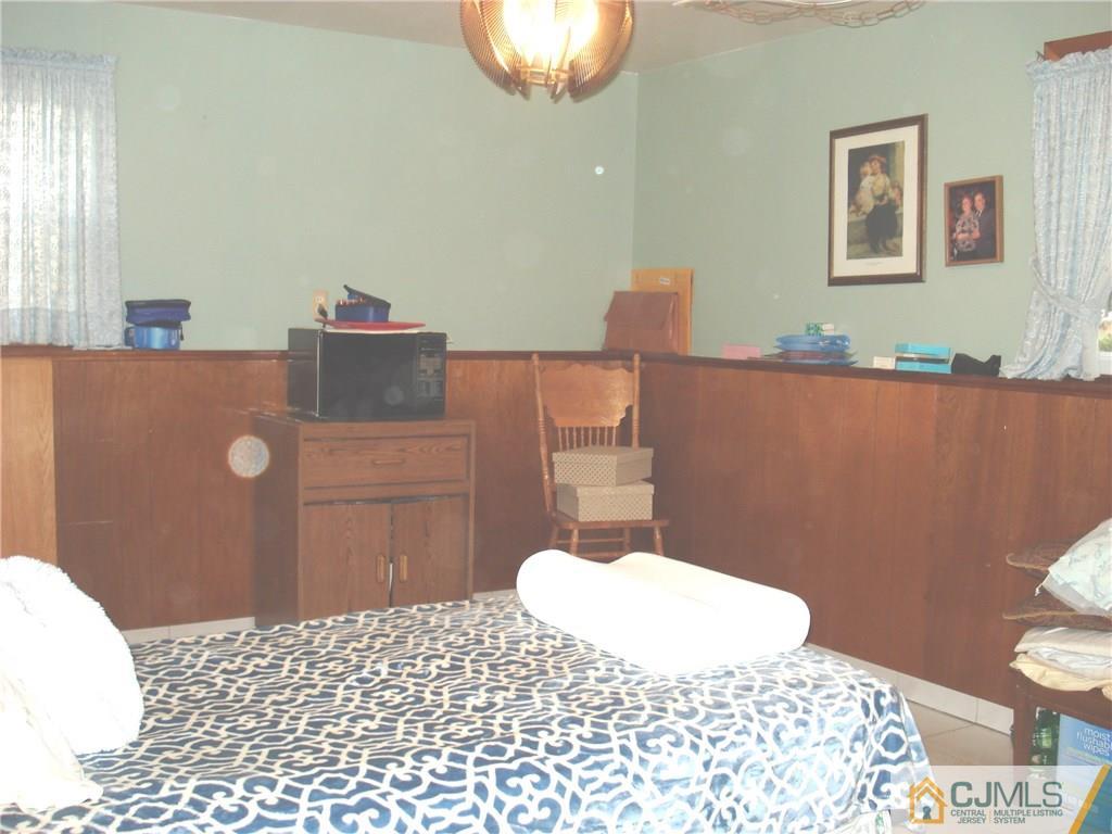 10 Morningside Road Colonia, NJ 07067 - Photo 11 of 18 a bathroom with a sink toilet and a mirror