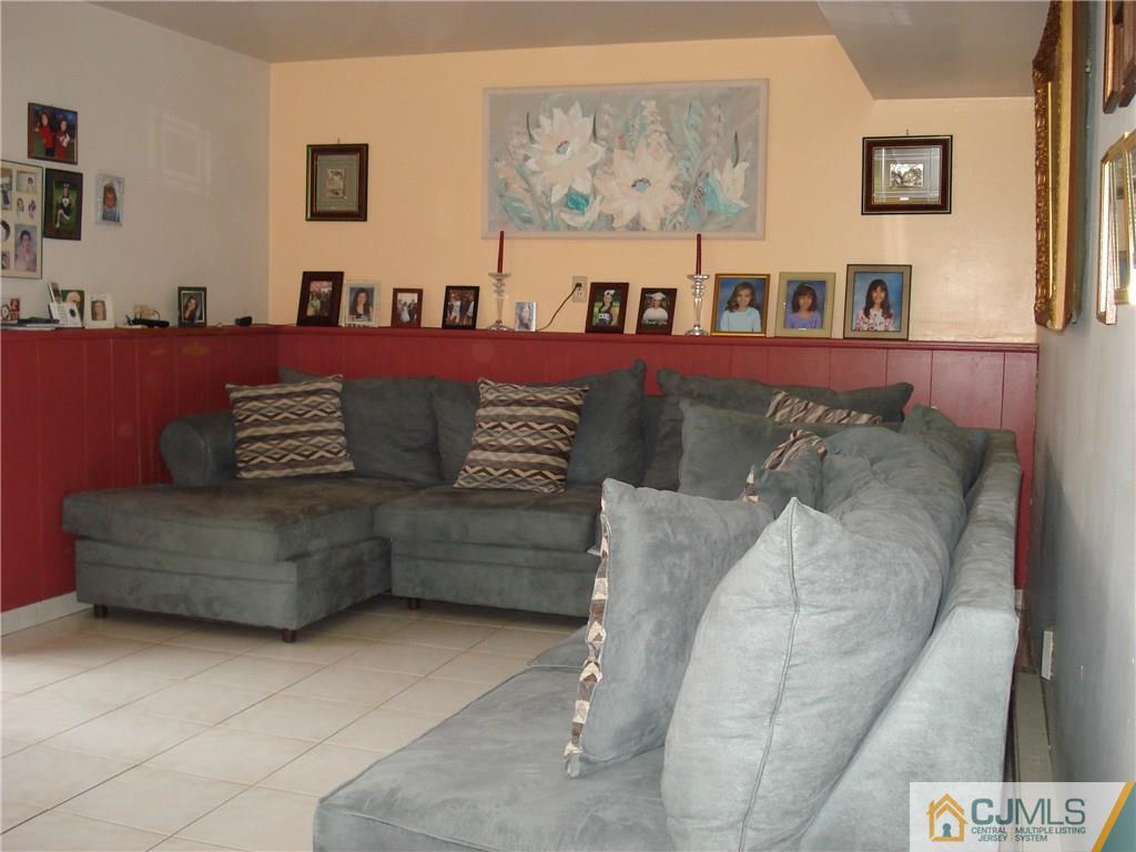10 Morningside Road Colonia, NJ 07067 - Photo 15 of 18 a living room with furniture and wall painting