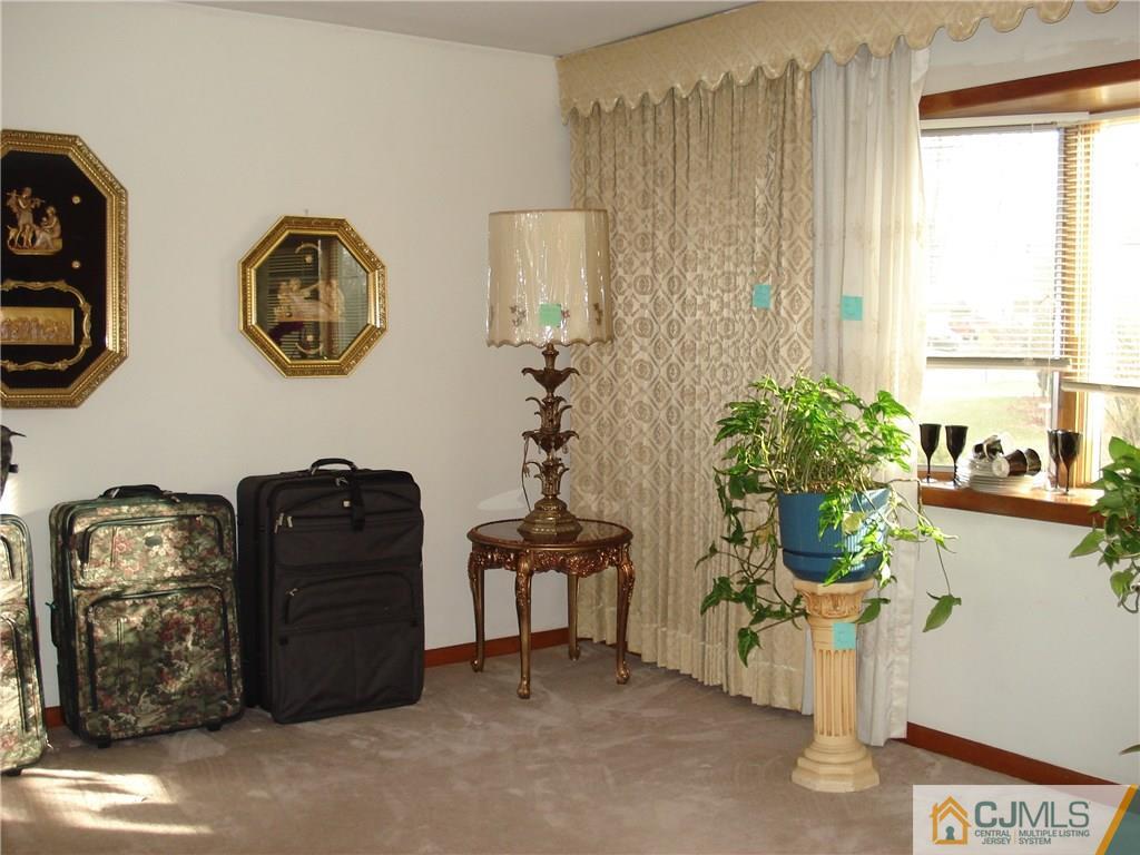 10 Morningside Road Colonia, NJ 07067 - Photo 3 of 18 a dining room with furniture and a window