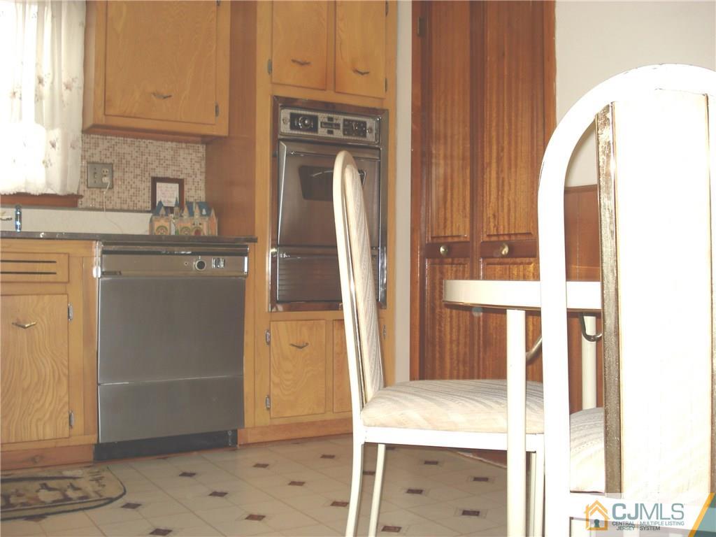 10 Morningside Road Colonia, NJ 07067 - Photo 5 of 18 a view of kitchen with granite countertop cabinets and refrigerator