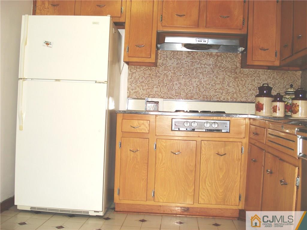 10 Morningside Road Colonia, NJ 07067 - Photo 6 of 18 a kitchen with granite countertop cabinets and appliances