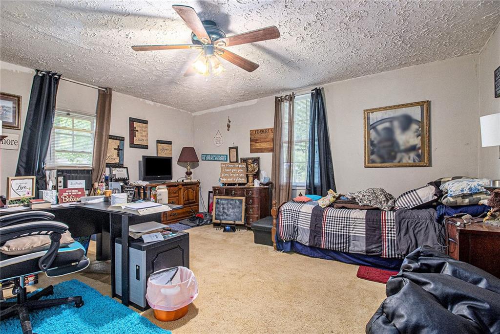 399 Rudy York Road Northwest Cartersville, GA 30121 - Photo 13 of 25 a living room with furniture a flat screen tv and a window