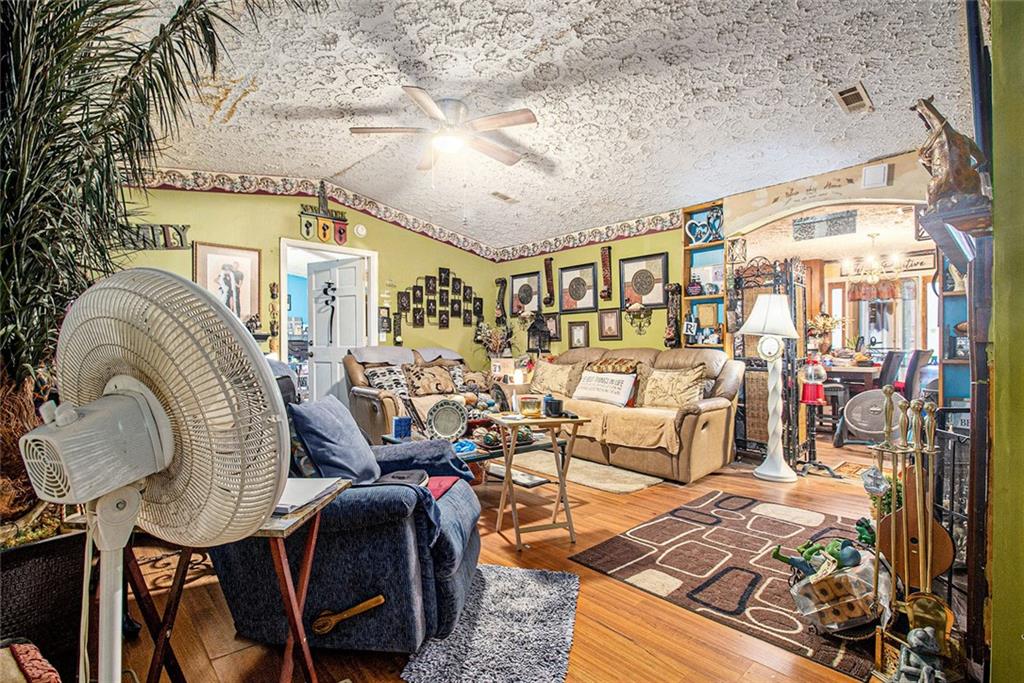 399 Rudy York Road Northwest Cartersville, GA 30121 - Photo 4 of 25 a living room with furniture and a fireplace