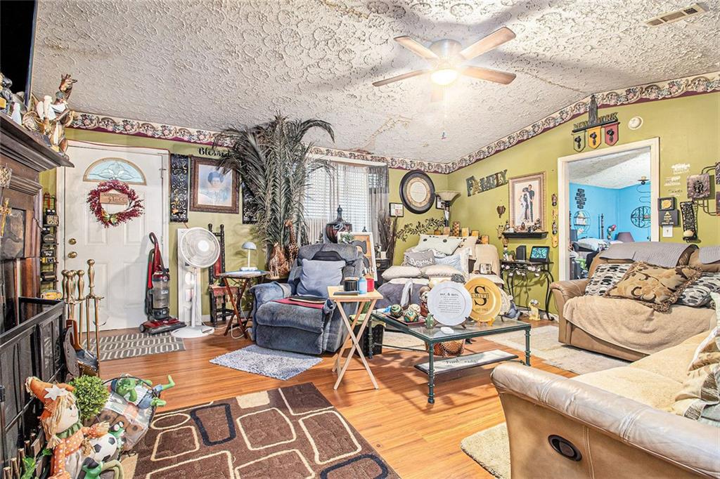 399 Rudy York Road Northwest Cartersville, GA 30121 - Photo 5 of 25 a living room with patio furniture and flowers