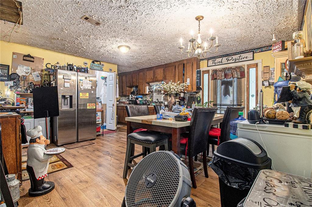 399 Rudy York Road Northwest Cartersville, GA 30121 - Photo 7 of 25 a view of a dining room with furniture and chandelier