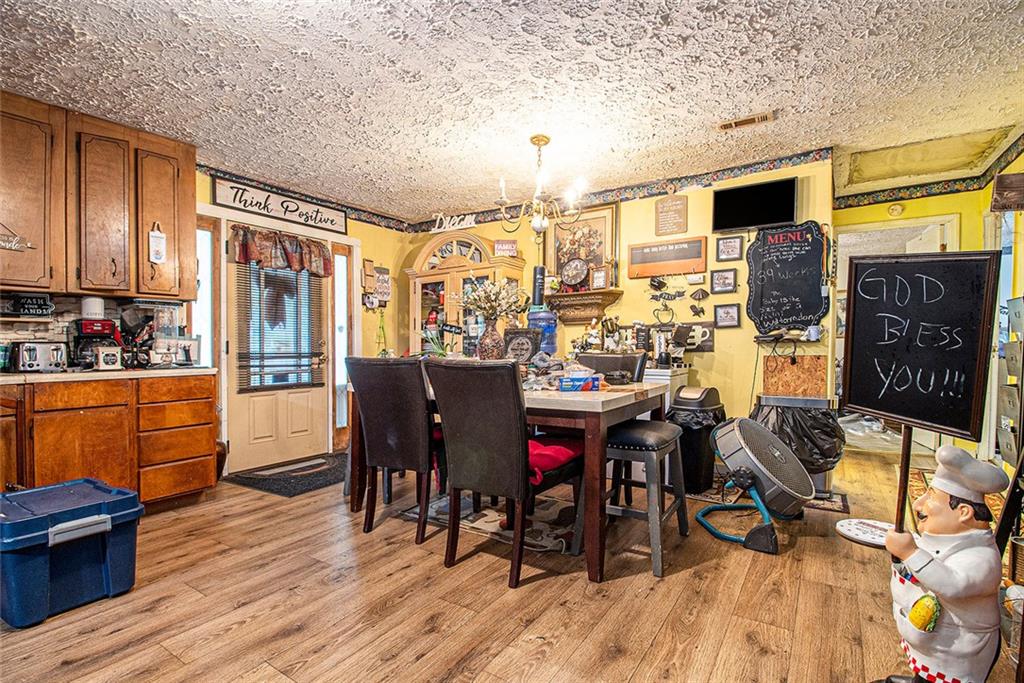 399 Rudy York Road Northwest Cartersville, GA 30121 - Photo 8 of 25 a view of a dining room with furniture and chandelier