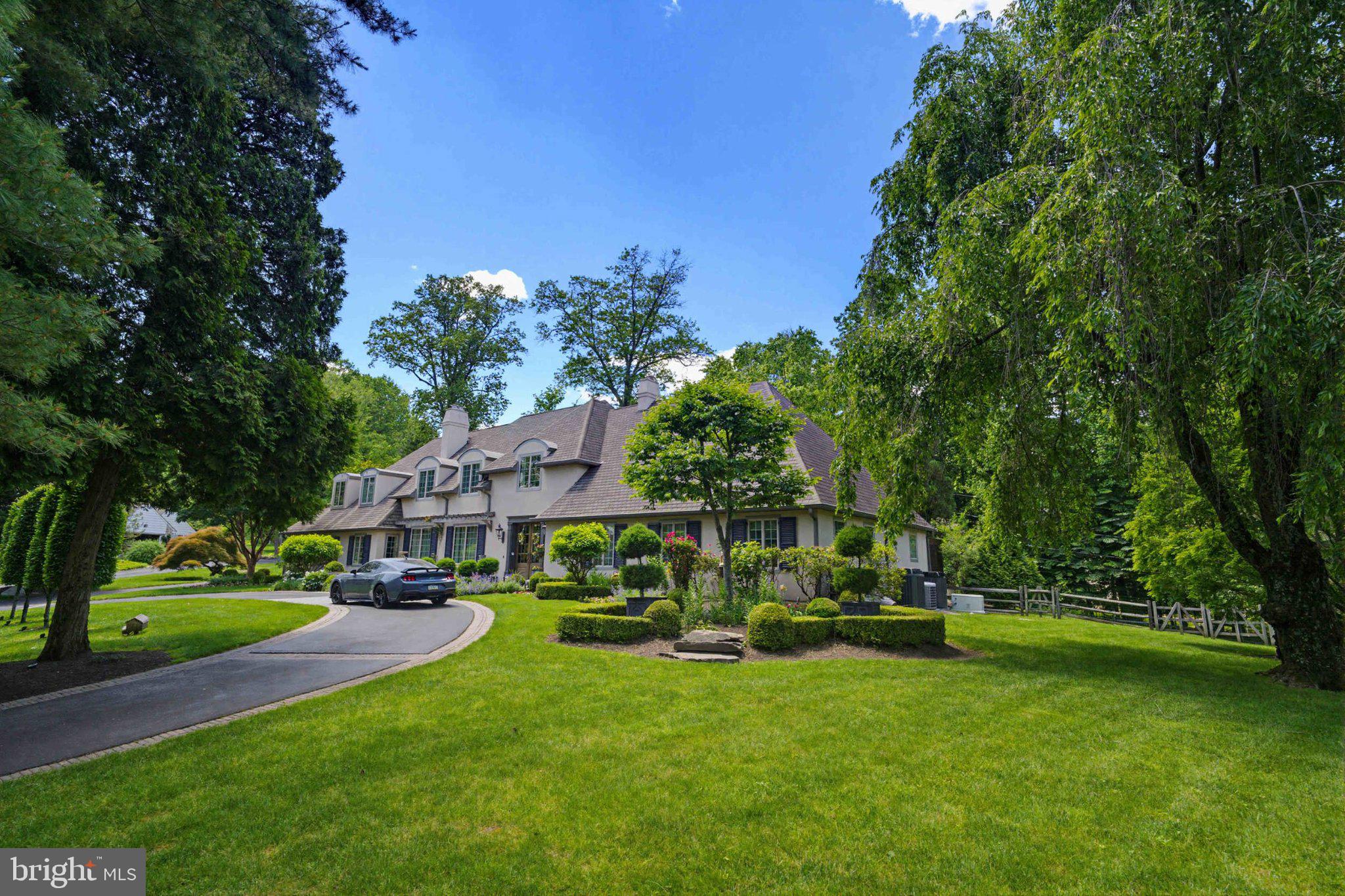 2244 Deer Path Road Huntingdon Valley, PA 19006 - Photo 4 of 95 Elegant home amidst lush greenery.