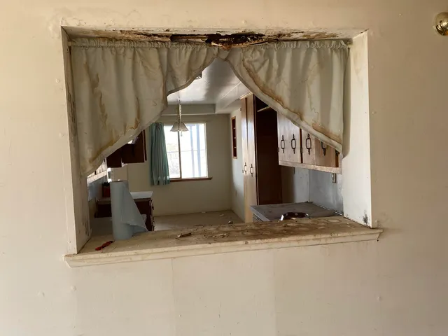 a roof deck with table and chairs