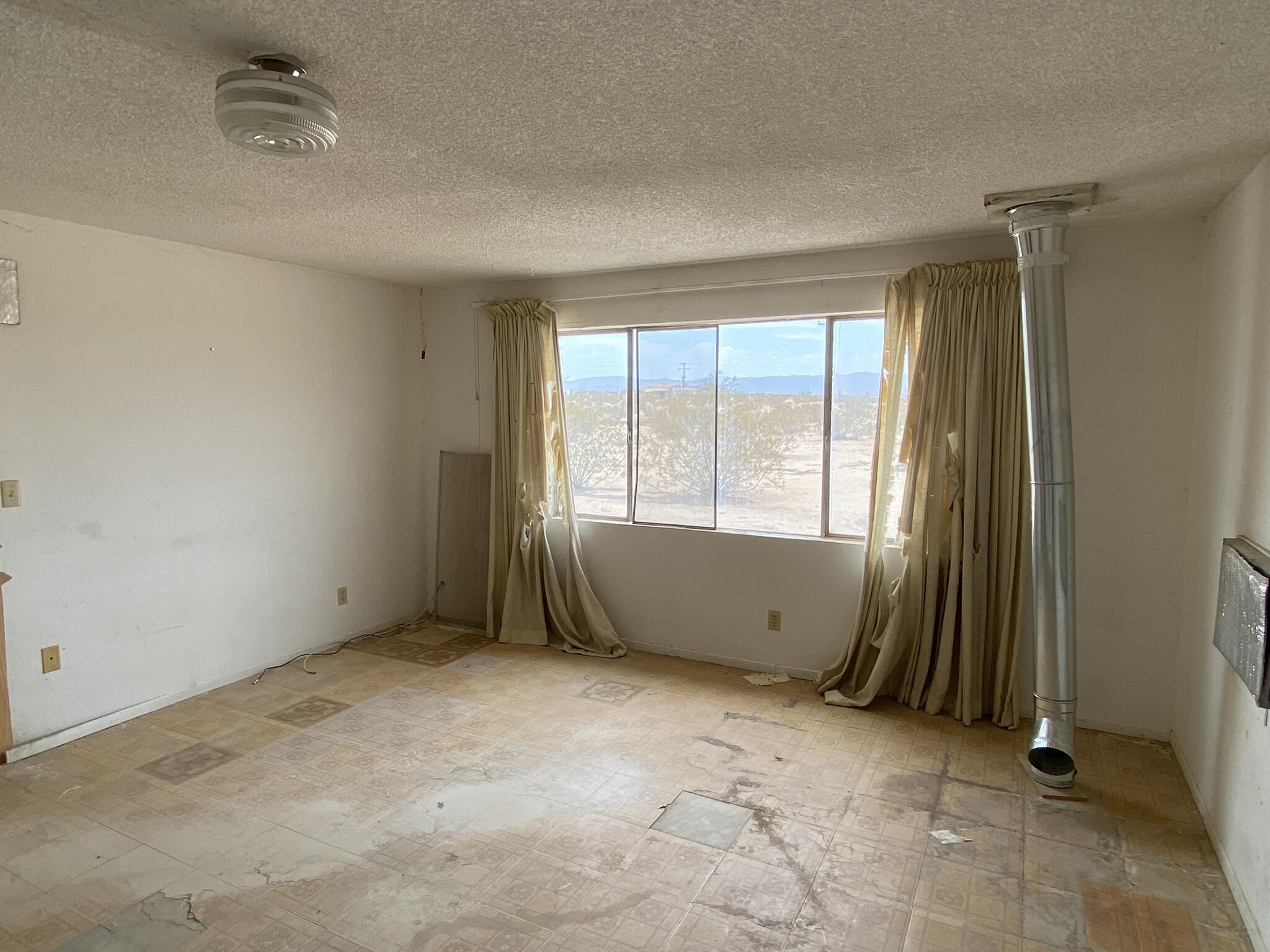 63325 Mesa Verde Joshua Tree, CA 92252 - Photo 32 of 39 an empty room with window