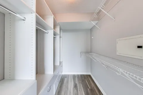 a view of a room with wooden floor and staircase