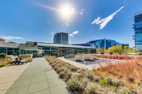 a view of a patio with table and chairs