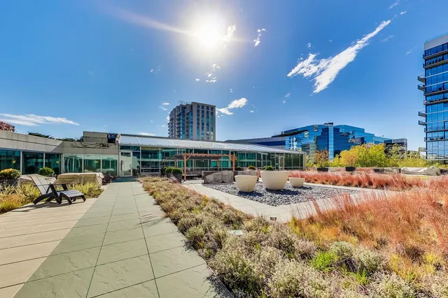 a view of a patio with table and chairs