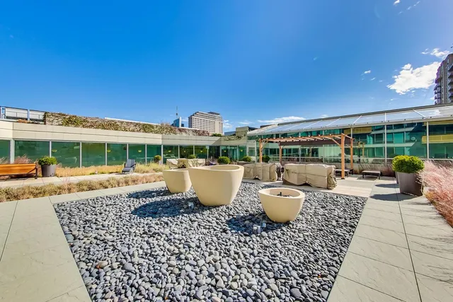 a swimming pool with outdoor seating and yard