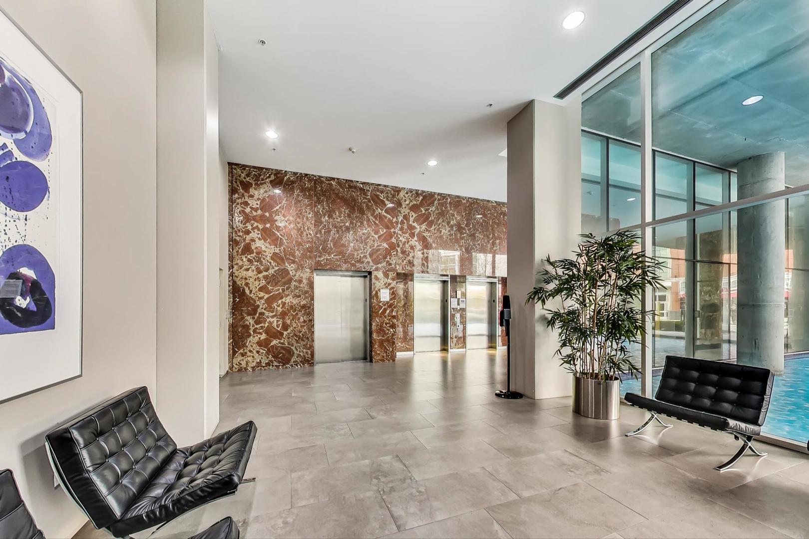 1720 Maple Avenue, Unit 1360 Evanston, IL 60201 - Photo 6 of 37 a lobby with furniture and potted plants