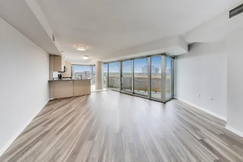 a view of a kitchen with a sink and dishwasher cabinets