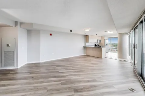 a view of kitchen view wooden floor and window