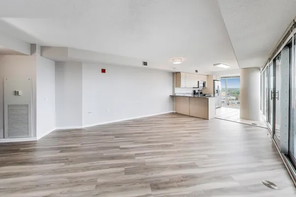 a view of kitchen view wooden floor and window