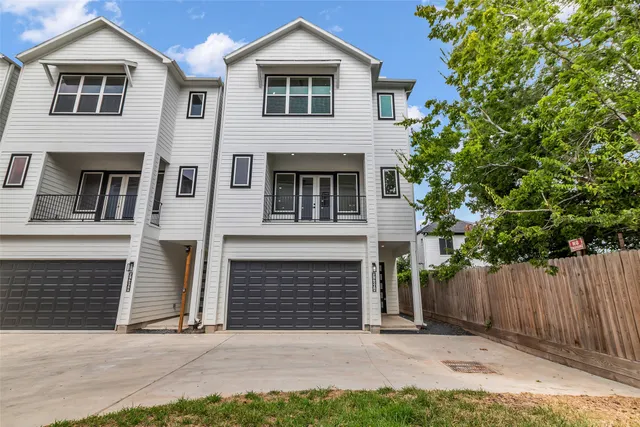 a front view of a house with a garage