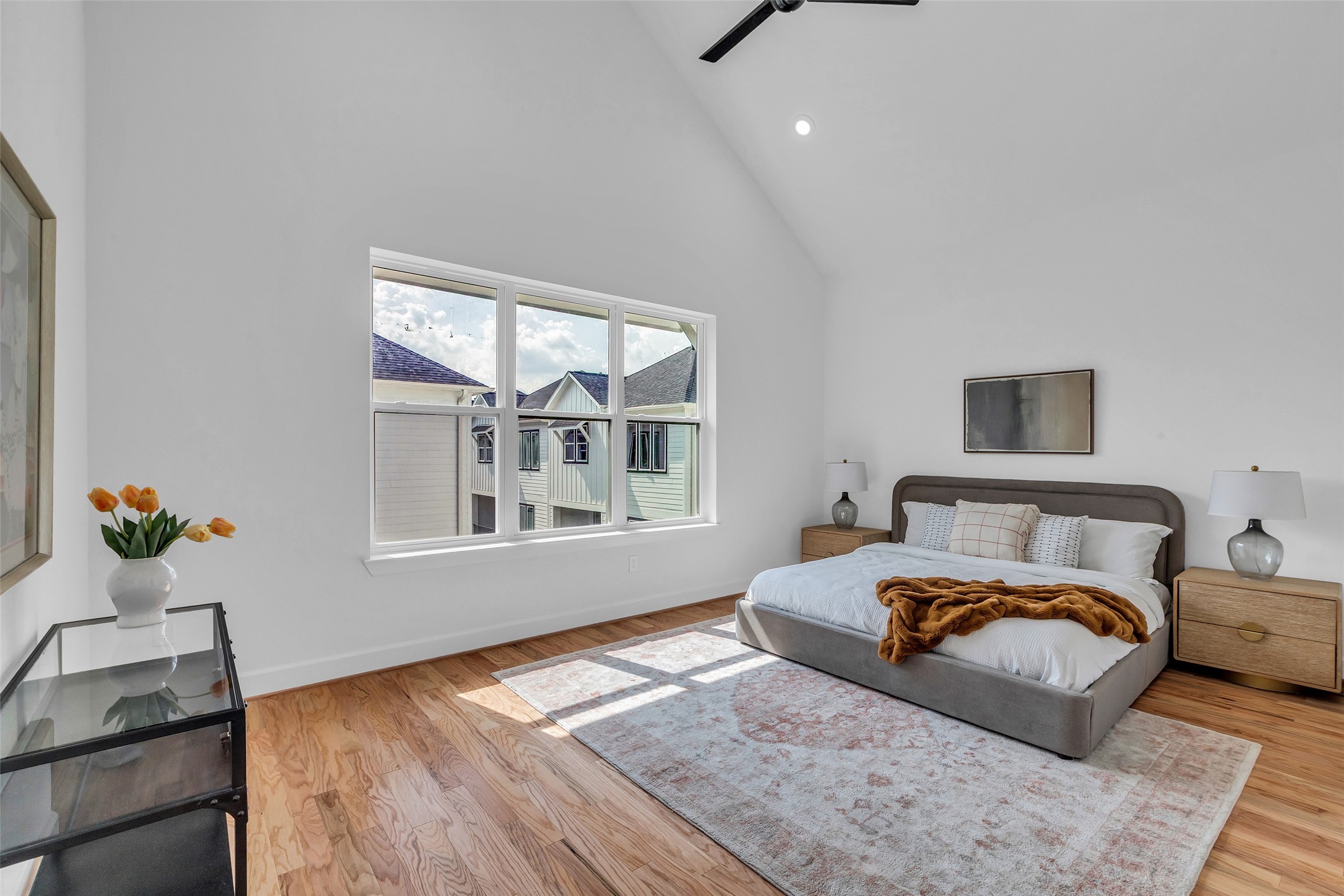 9426 Campbell Road, Unit A Houston, TX 77080 - Photo 18 of 26 a bed room with a bed window and potted plant on a dresser