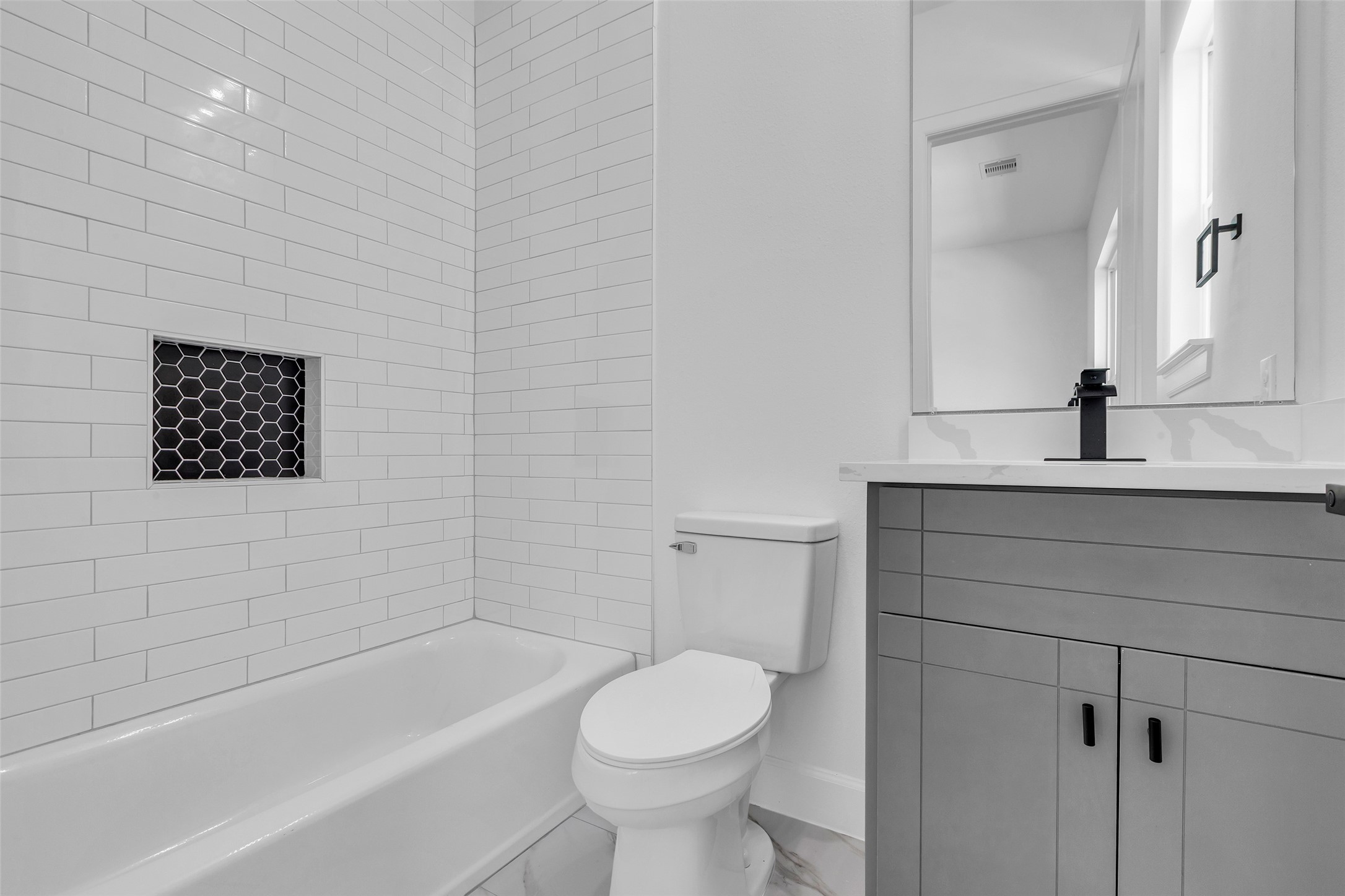 9426 Campbell Road, Unit A Houston, TX 77080 - Photo 23 of 26 a bathroom with a sink toilet and shower