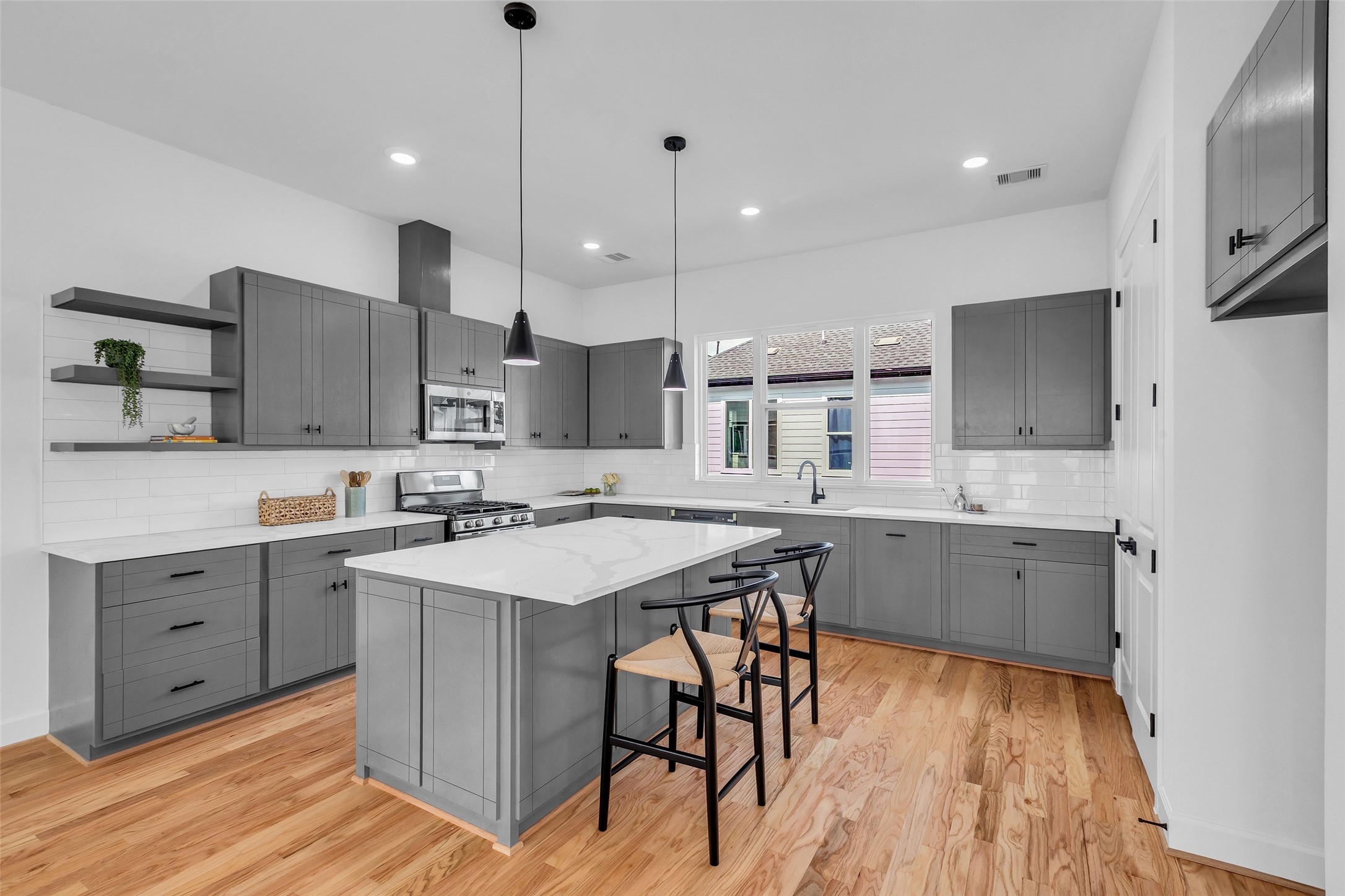 9426 Campbell Road, Unit A Houston, TX 77080 - Photo 5 of 26 a kitchen with cabinets a sink and appliances
