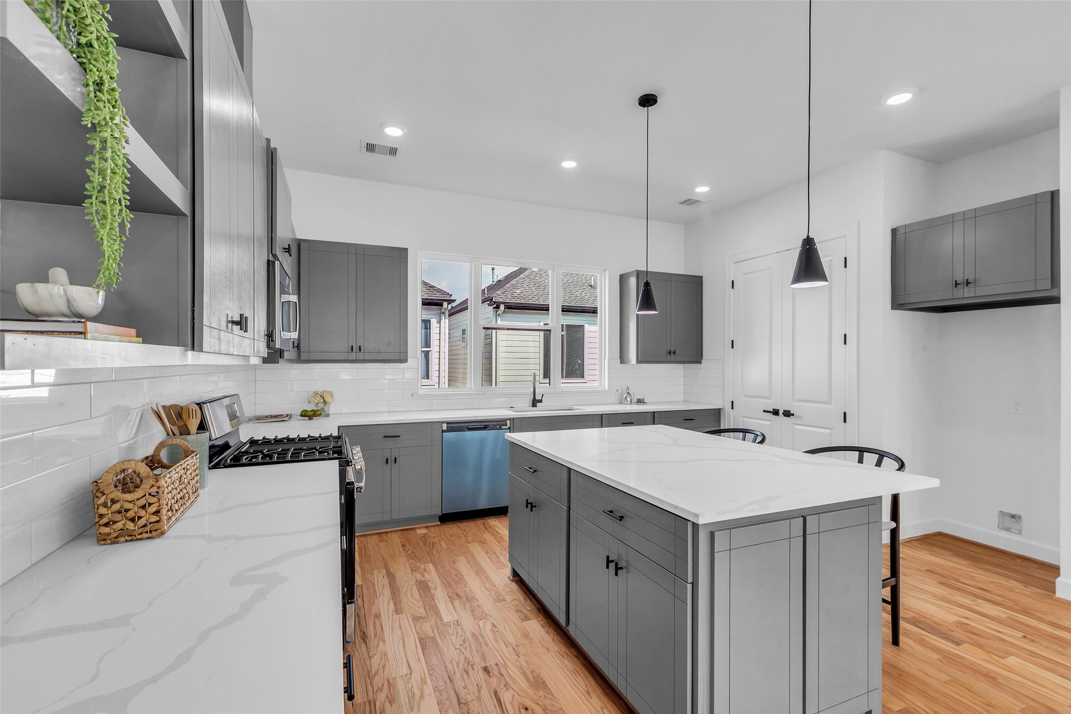 9426 Campbell Road, Unit A Houston, TX 77080 - Photo 8 of 26 a kitchen with a sink stove and refrigerator
