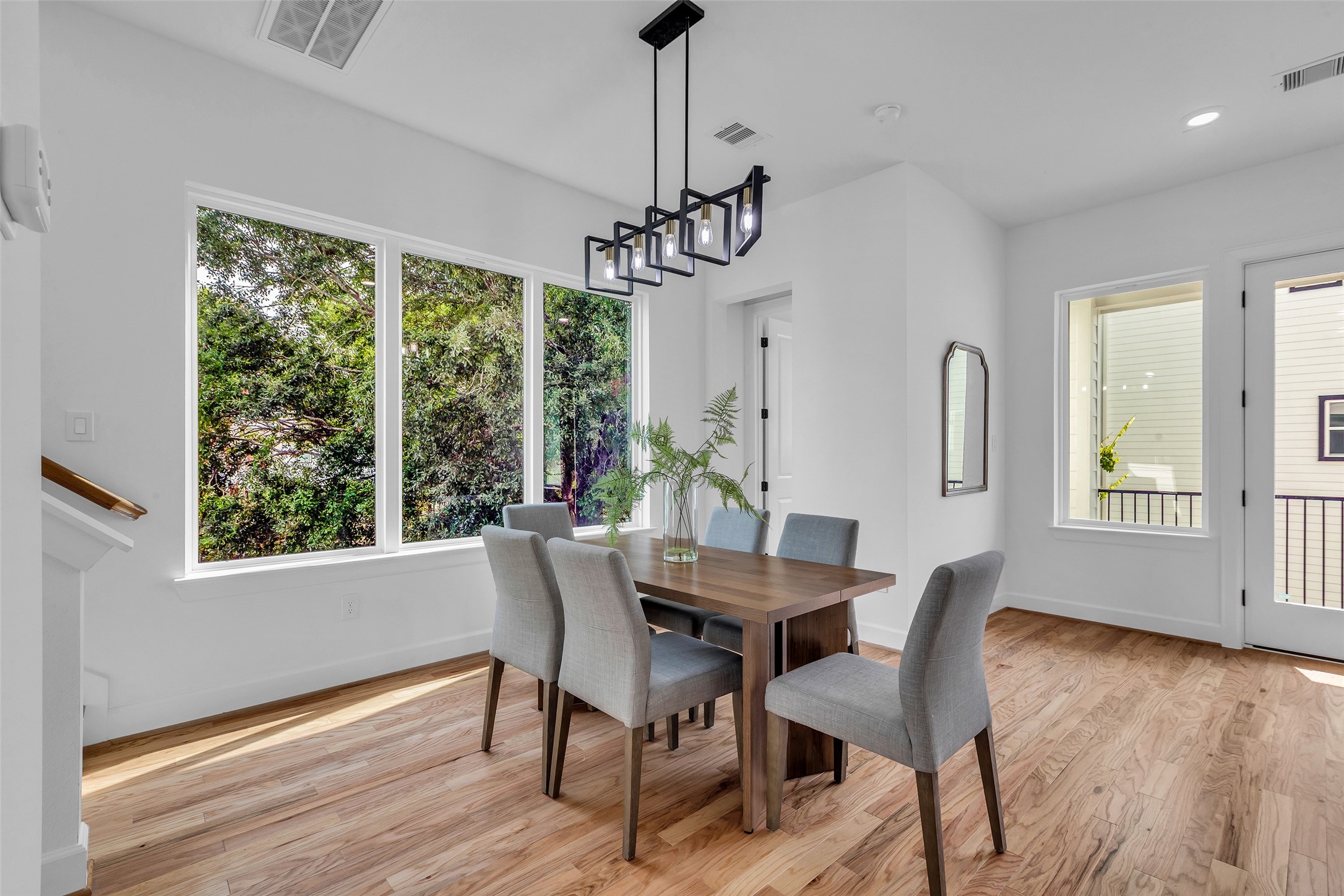 9426 Campbell Road, Unit A Houston, TX 77080 - Photo 9 of 26 a view of a dining room with furniture window and wooden floor