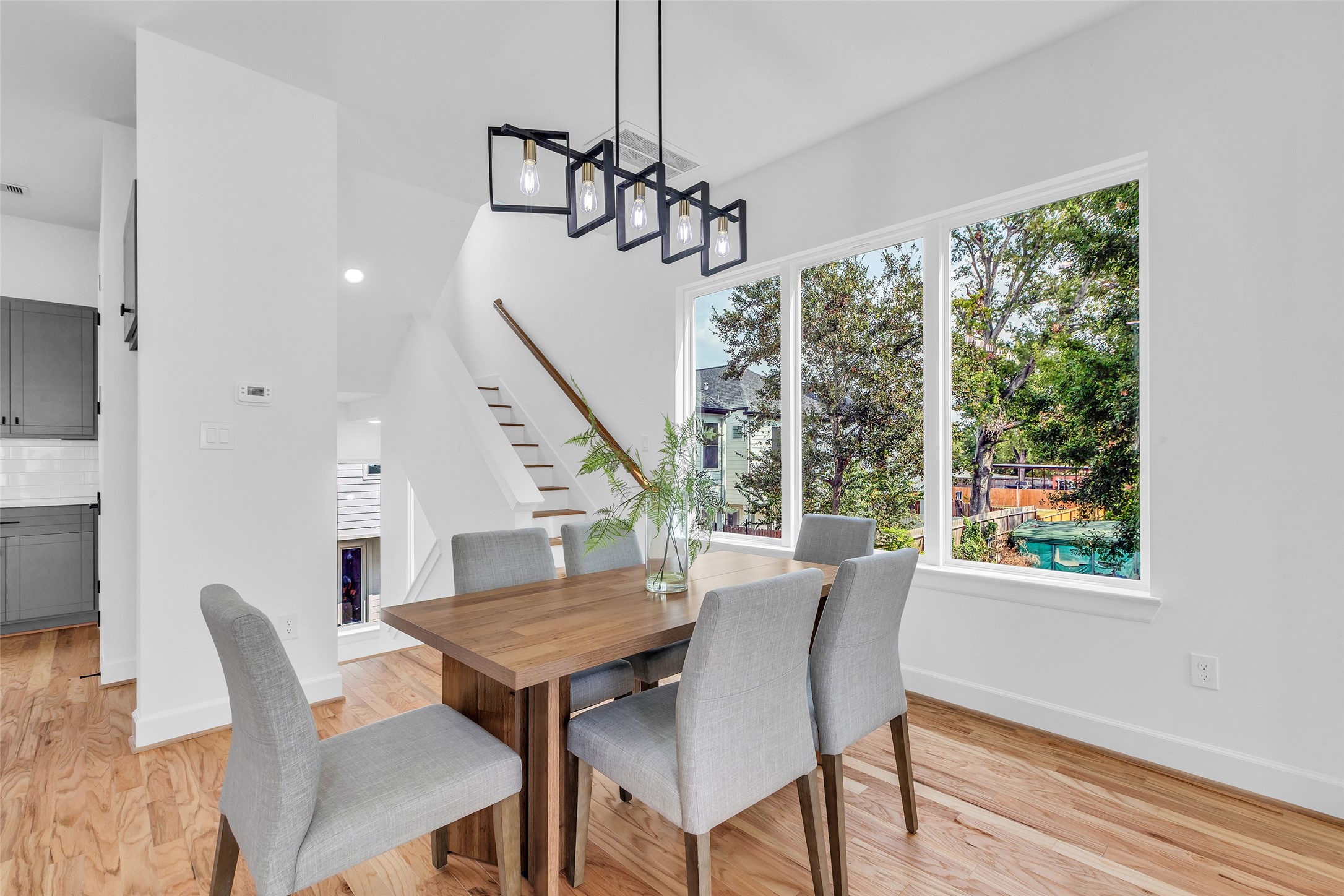 9426 Campbell Road, Unit A Houston, TX 77080 - Photo 10 of 26 a view of a dining room with furniture window and wooden floor