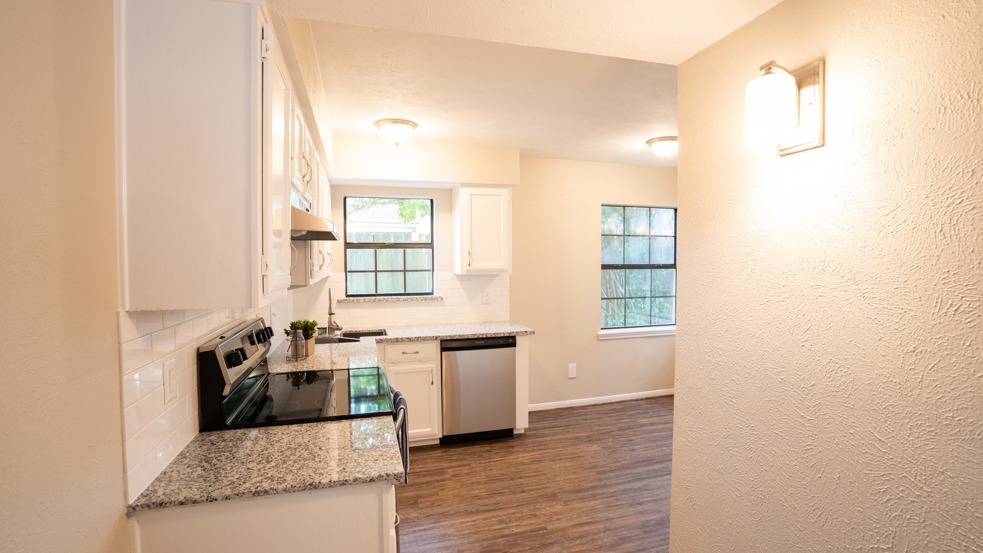 17 Regency Lane Houston, TX 77088 - Photo 13 of 23 a living room with stainless steel appliances granite countertop furniture and a fireplace