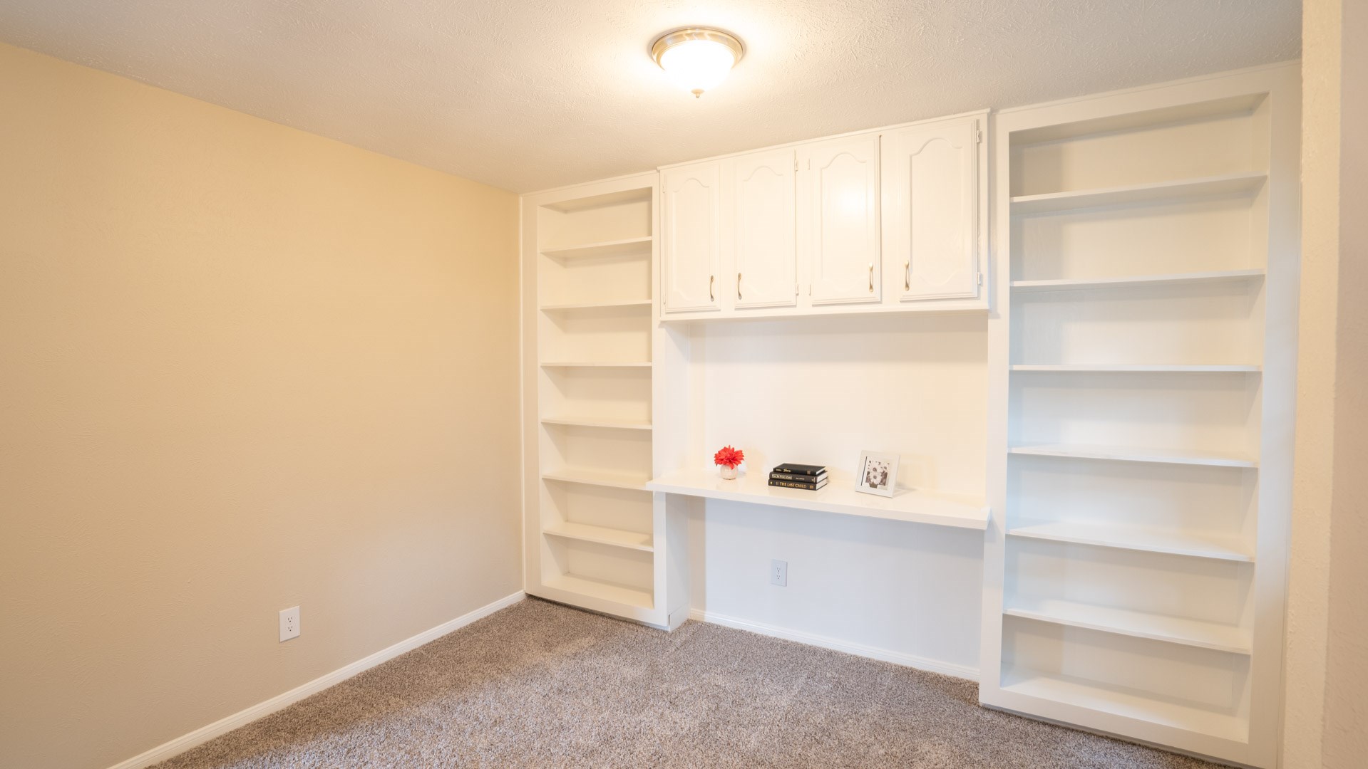 17 Regency Lane Houston, TX 77088 - Photo 17 of 23 a room with a closet and wooden shelves