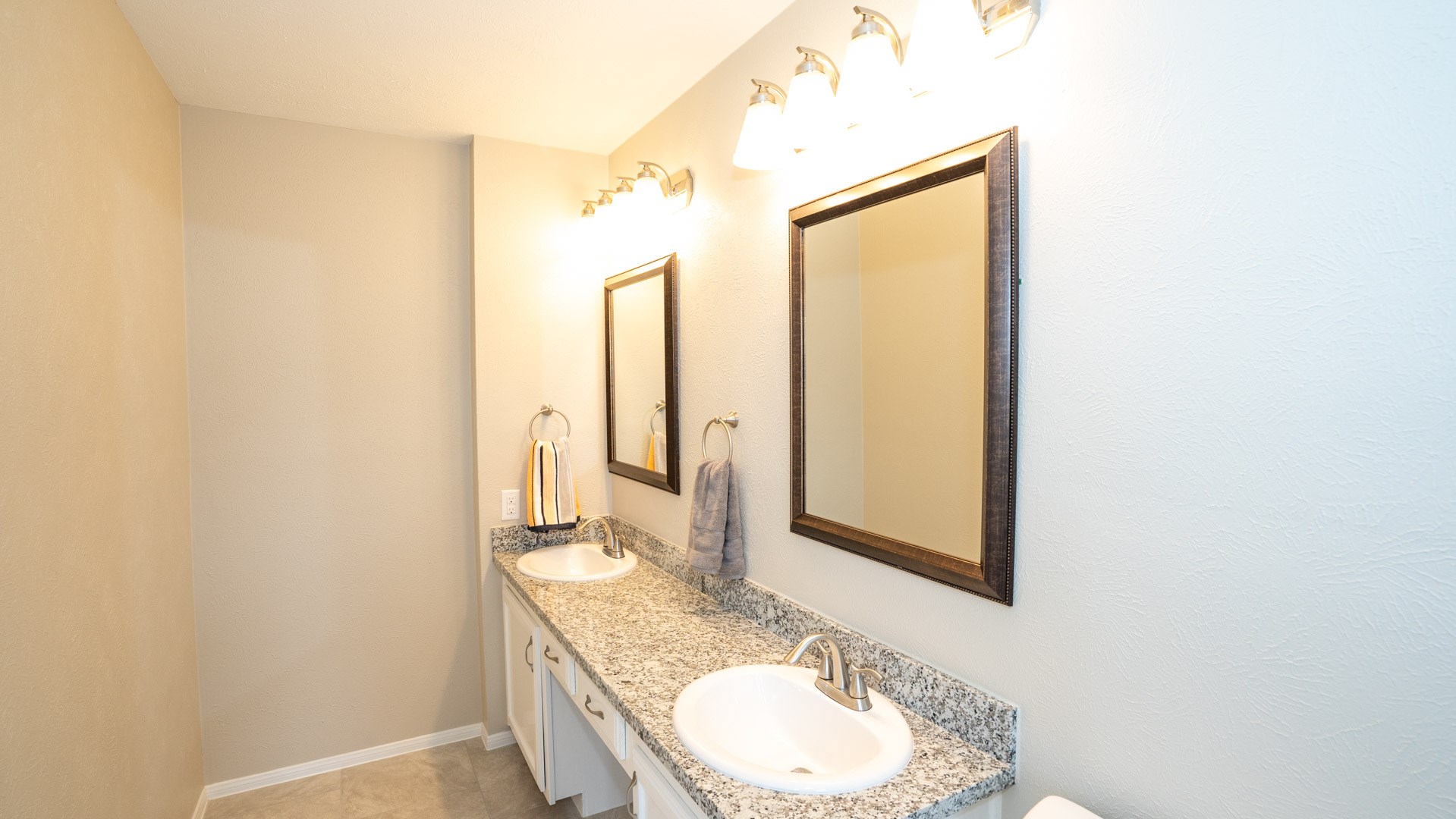 17 Regency Lane Houston, TX 77088 - Photo 21 of 23 a bathroom with a granite countertop sink and a mirror