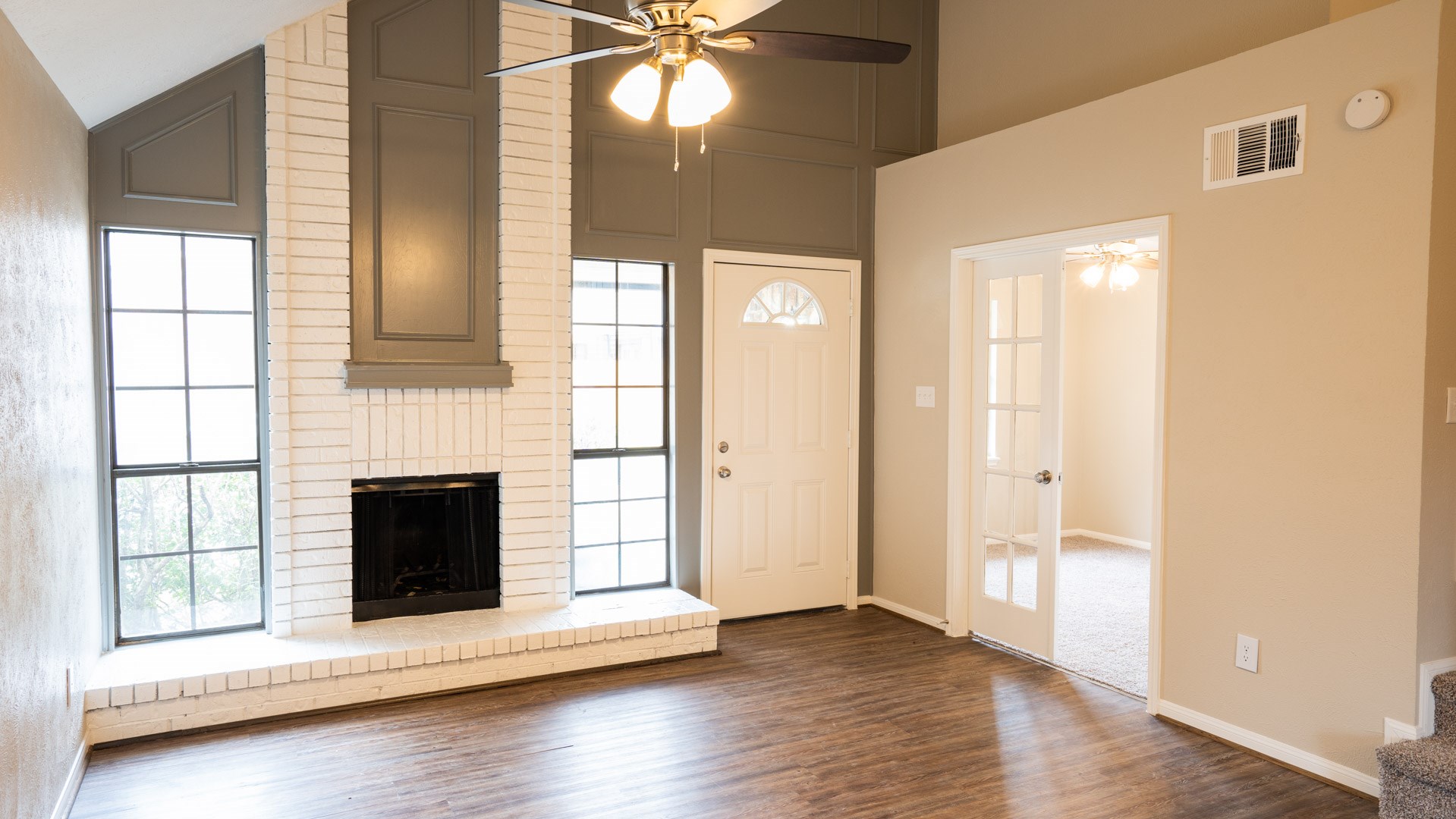 17 Regency Lane Houston, TX 77088 - Photo 4 of 23 a view of an empty room with wooden floor and a window