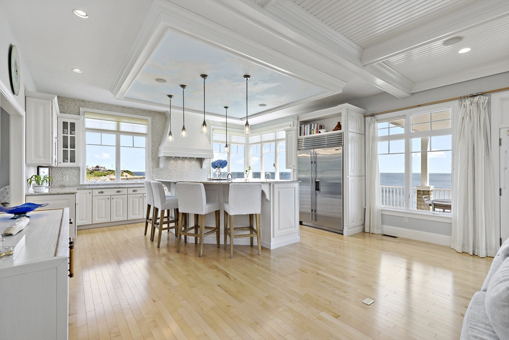 135 Stage Point Road Plymouth, MA 02360 - Photo 8 of 16 a open kitchen with cabinets table and chairs