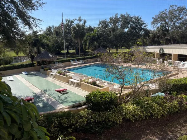 a view of a water fountain and a yard