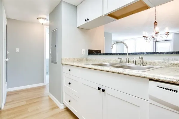 a bathroom with a sink double vanity and a mirror