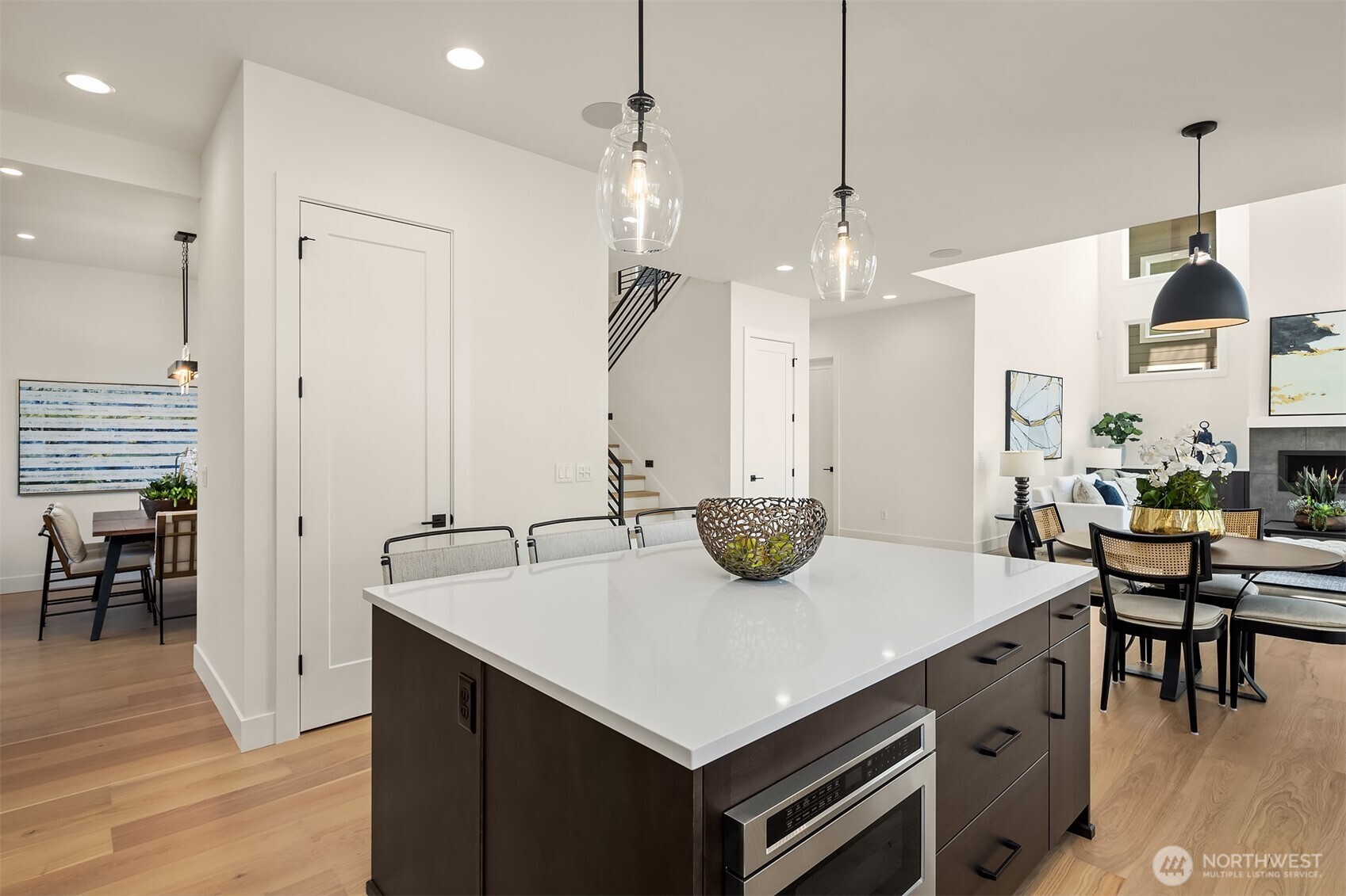 5816 Northeast 4th Place Renton, WA 98059 - Photo 12 of 25 a kitchen with a table chairs and white cabinets