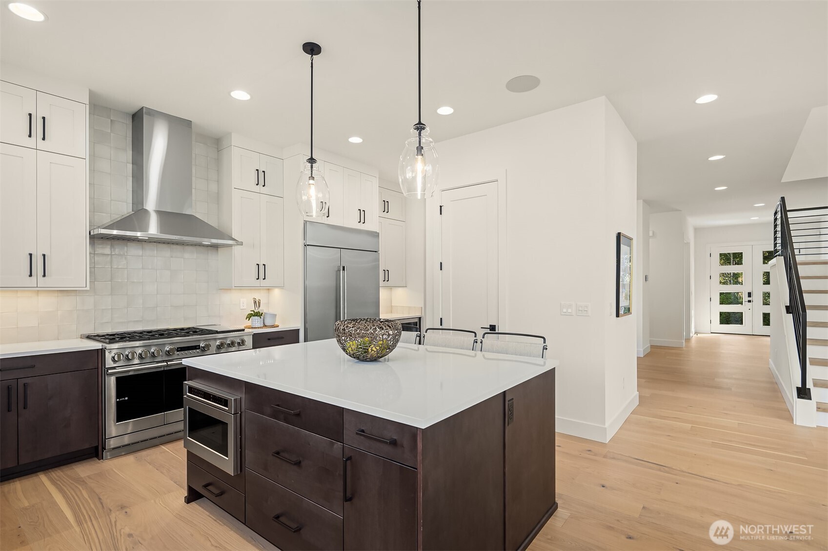 5816 Northeast 4th Place Renton, WA 98059 - Photo 13 of 25 a kitchen with a stove a sink and a refrigerator