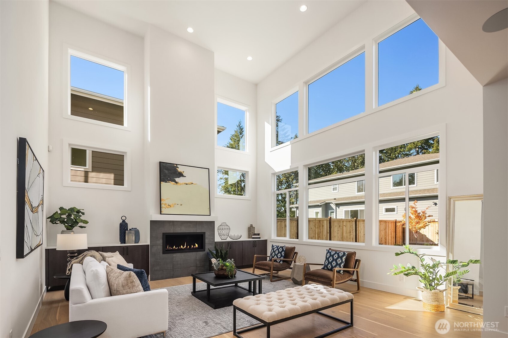5816 Northeast 4th Place Renton, WA 98059 - Photo 15 of 25 a living room with furniture a fireplace and potted plants