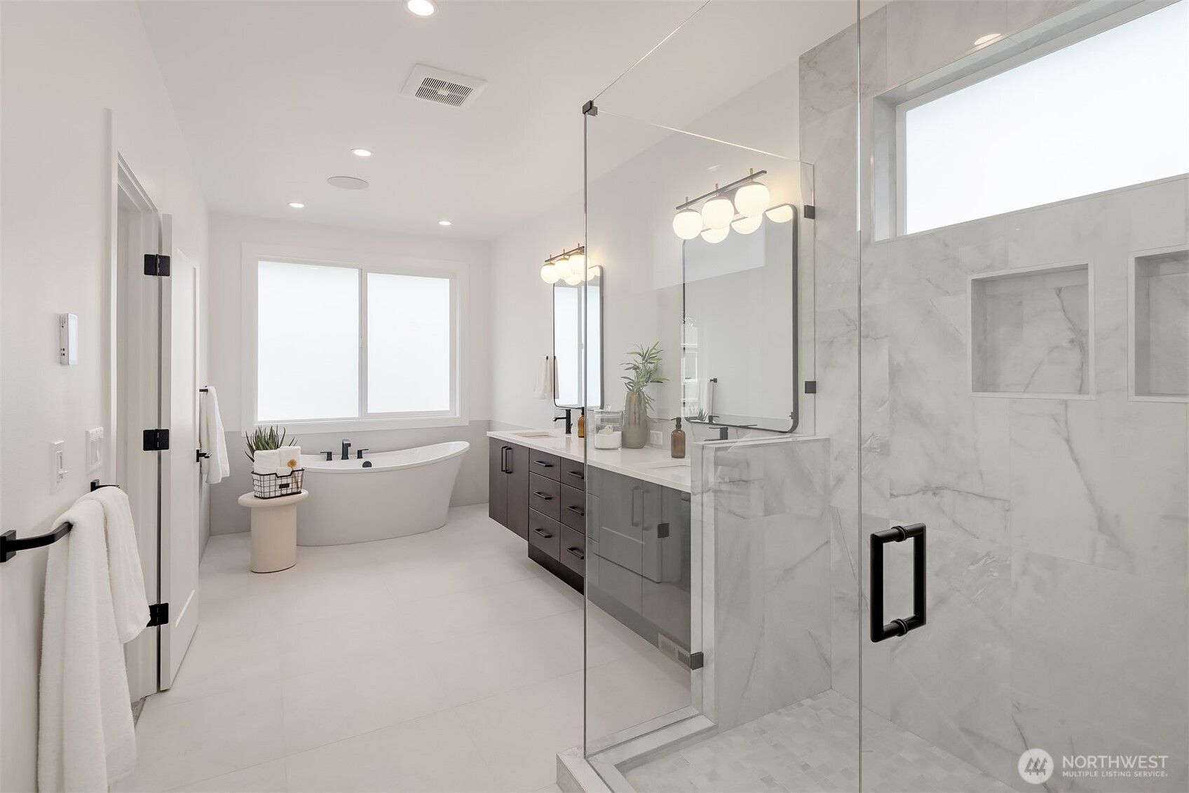 5816 Northeast 4th Place Renton, WA 98059 - Photo 20 of 25 a large white kitchen with a large window
