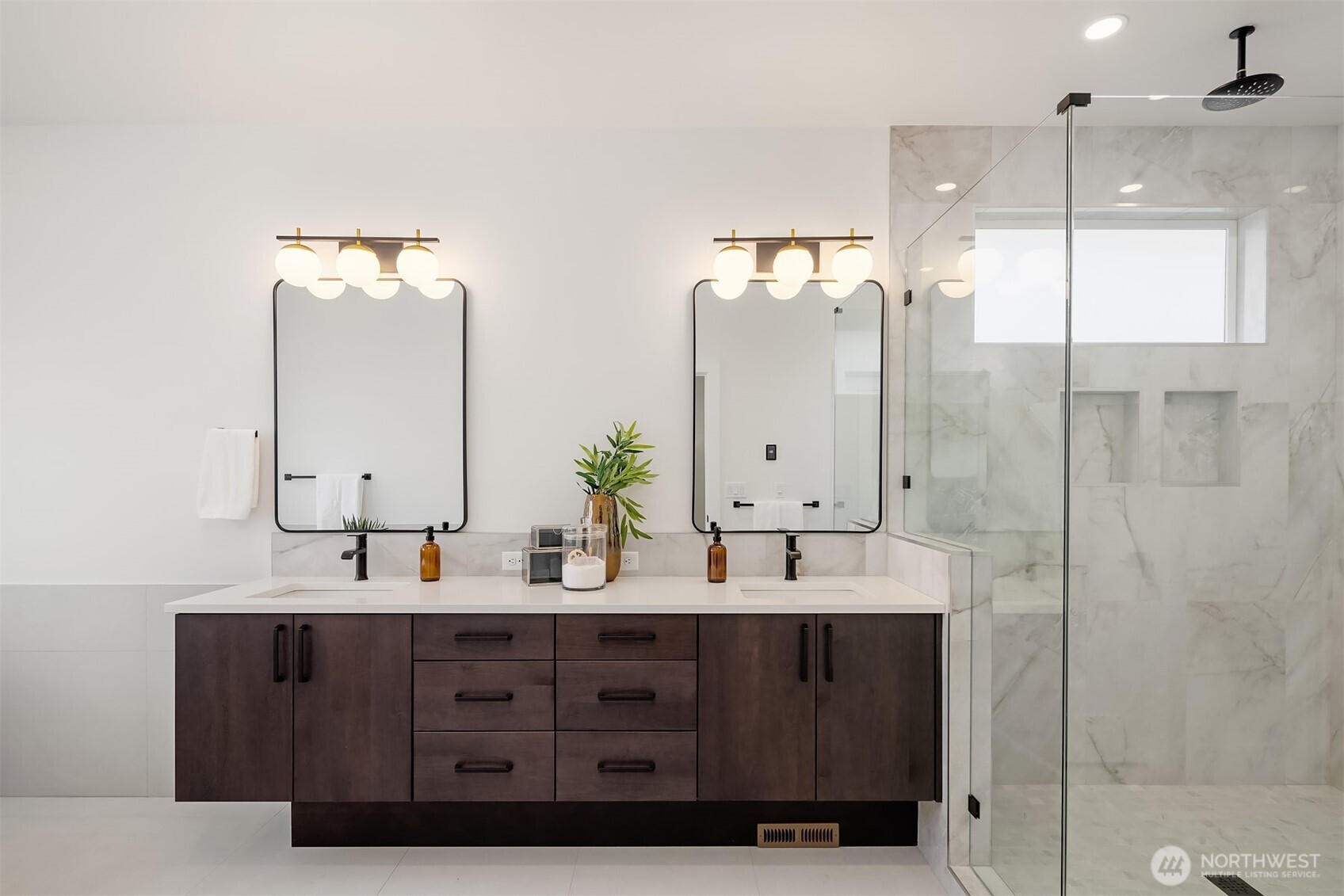 5816 Northeast 4th Place Renton, WA 98059 - Photo 21 of 25 a bathroom with double vanity sinks and a mirror