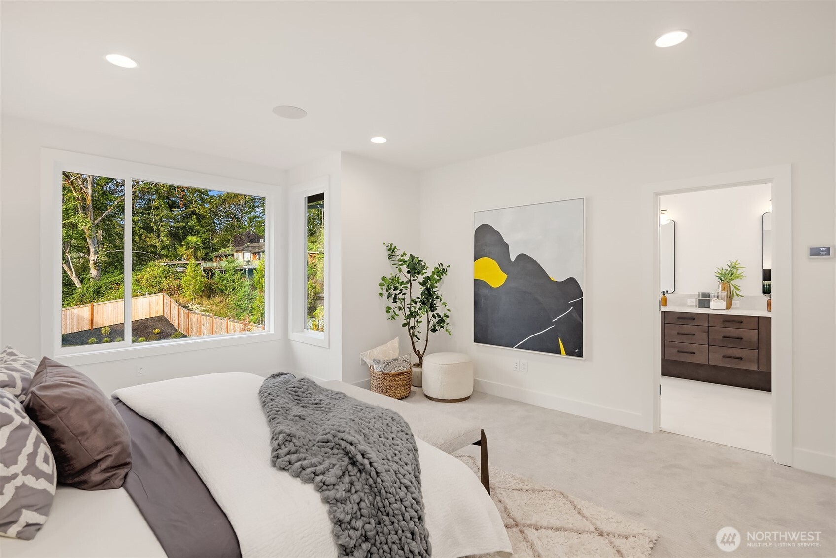 5816 Northeast 4th Place Renton, WA 98059 - Photo 24 of 25 a bedroom with a large bed and a large window