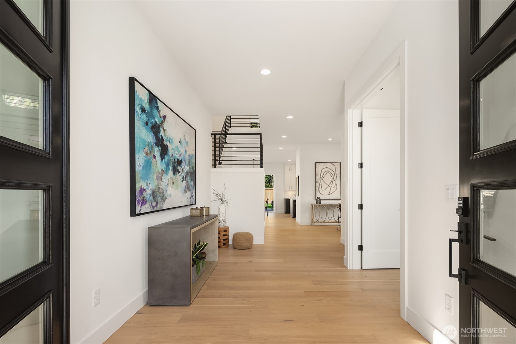 5816 Northeast 4th Place Renton, WA 98059 - Photo 4 of 25 a view of a living room with a flat screen tv