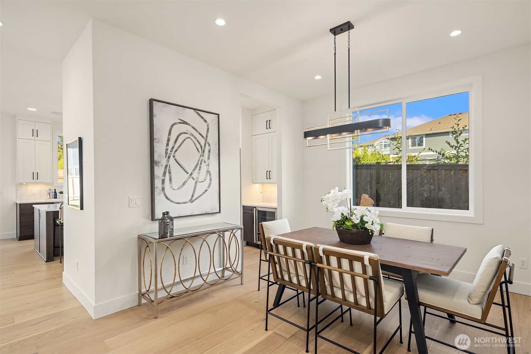 5816 Northeast 4th Place Renton, WA 98059 - Photo 7 of 25 a view of a dining room with furniture window and wooden floor