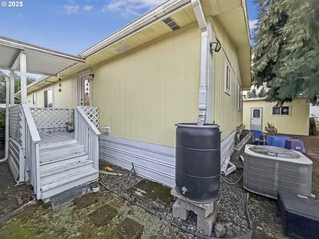 a front view of a house with outdoor seating